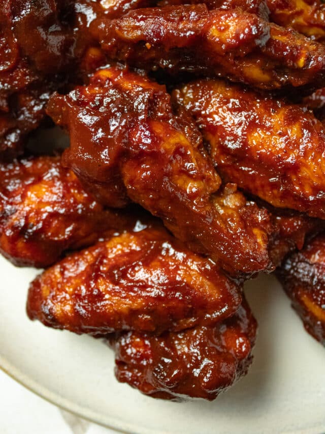 Close up image of saucy bbq wings.