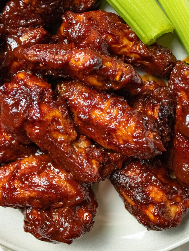 Close up image of bbq wings on a plate.