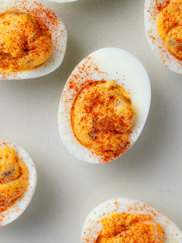 Deviled eggs with a sprinkle of ground paprika.