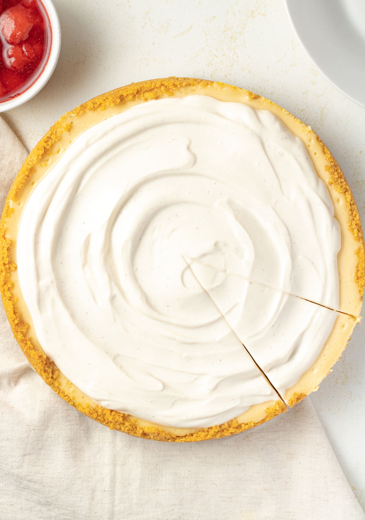 Overhead image of cheesecake on a table.