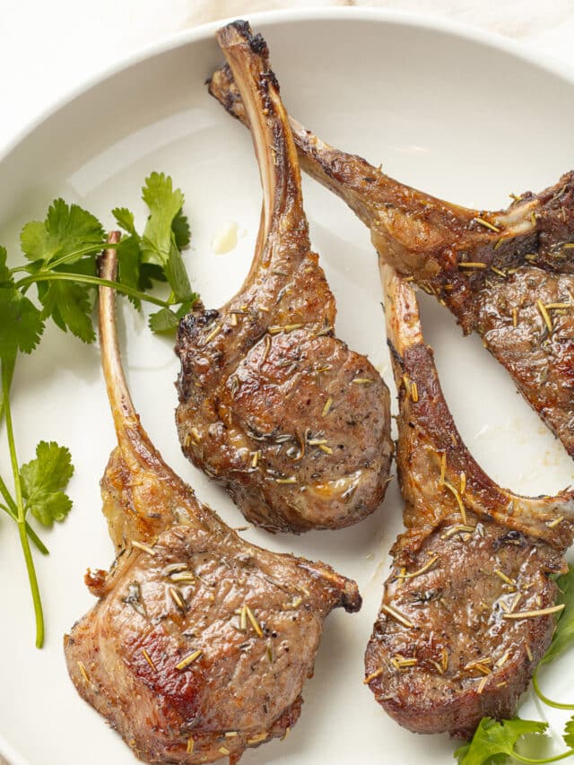 Lamb chops on a plate.