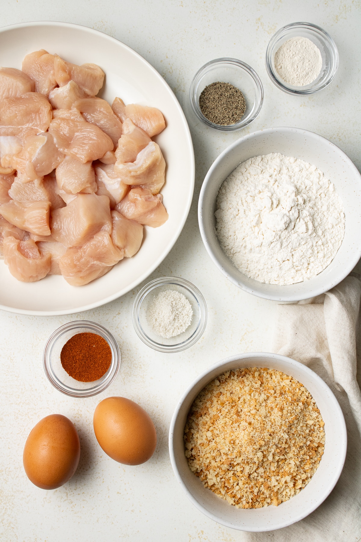 Ingredients for chicken nuggets on a counter.