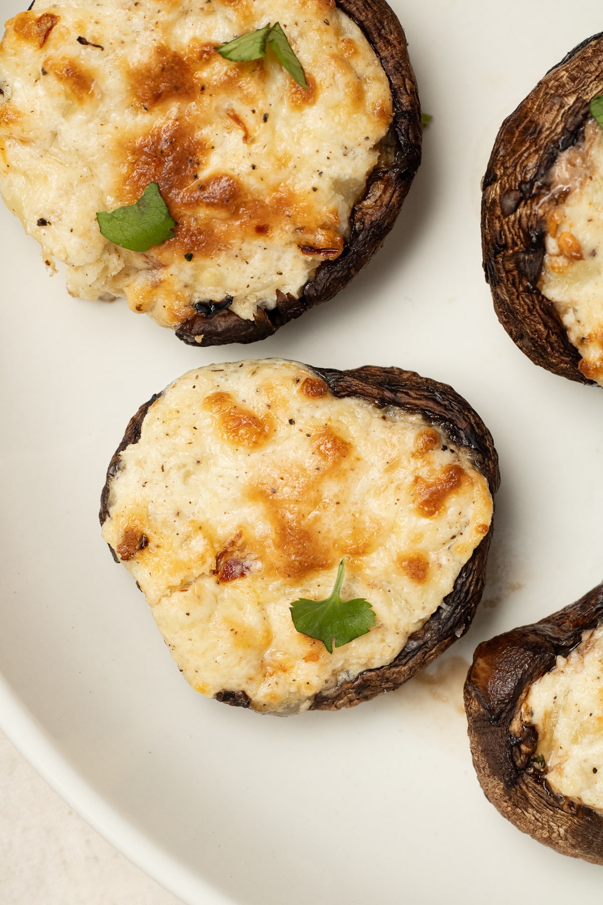 Cream Cheese Stuffed mushrooms on a plate.
