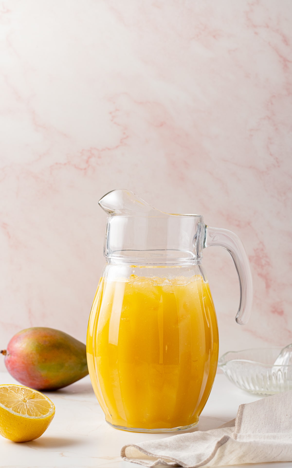 Close up image of a pitcher of lemonade.