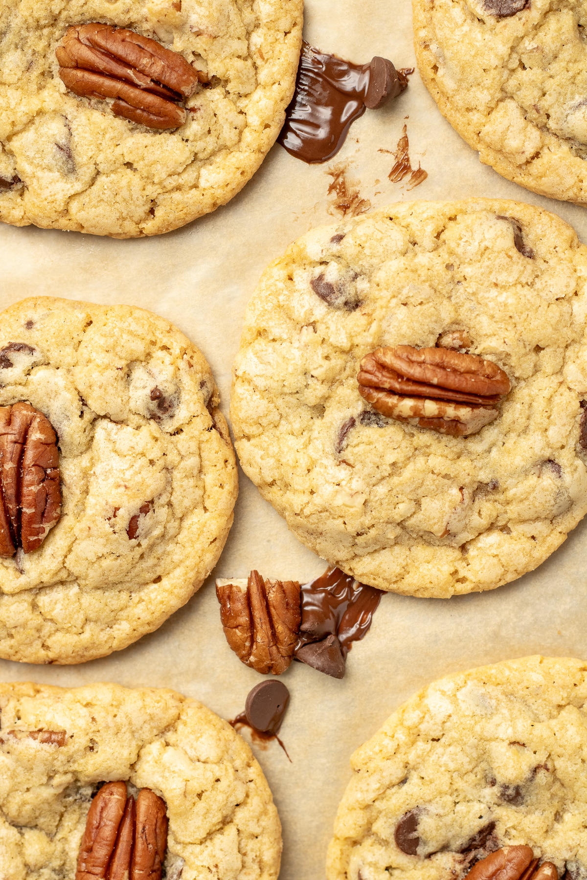 Chocolate chip pecan cookies on a sheet pan.