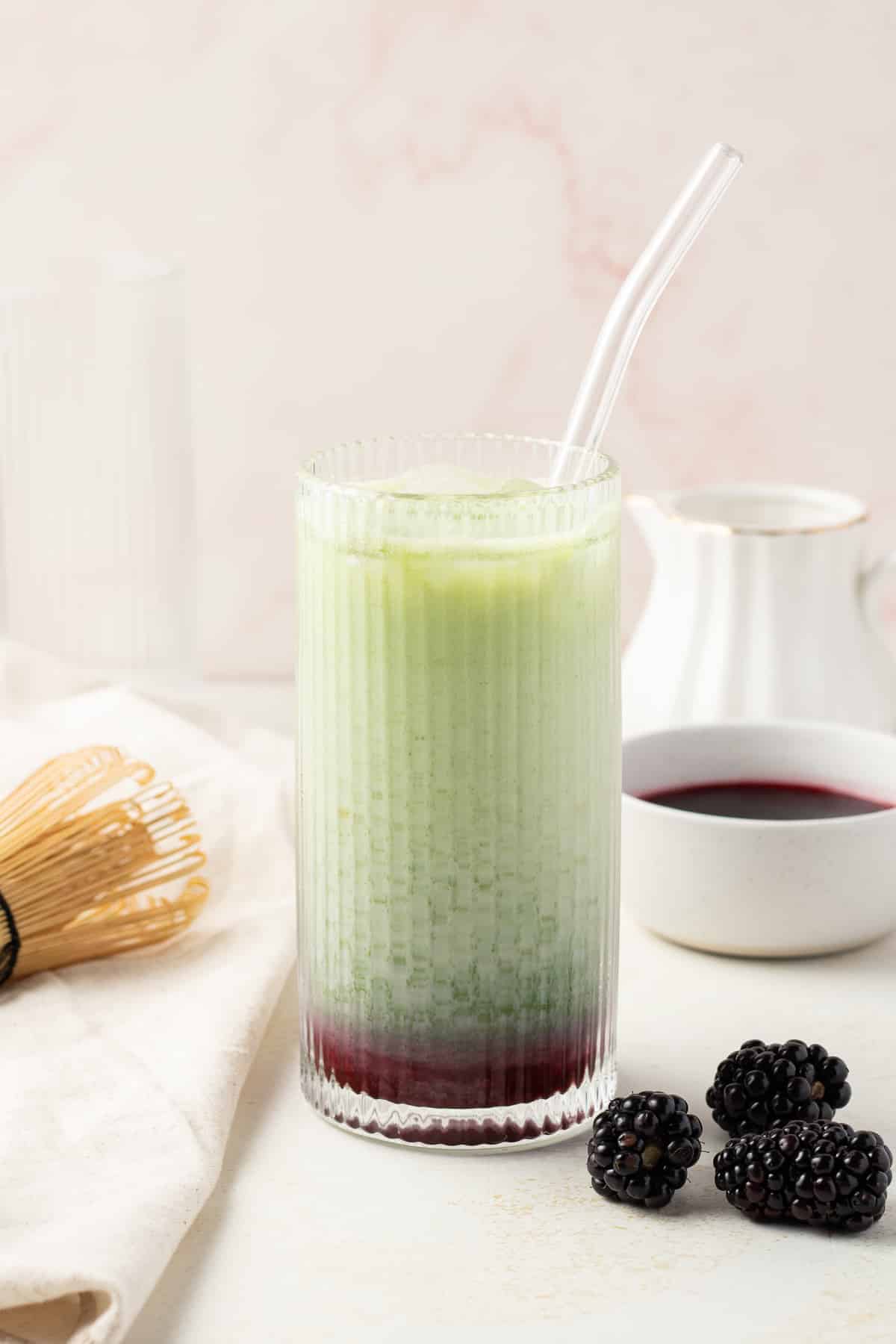 Side view of matcha latte in a cup.