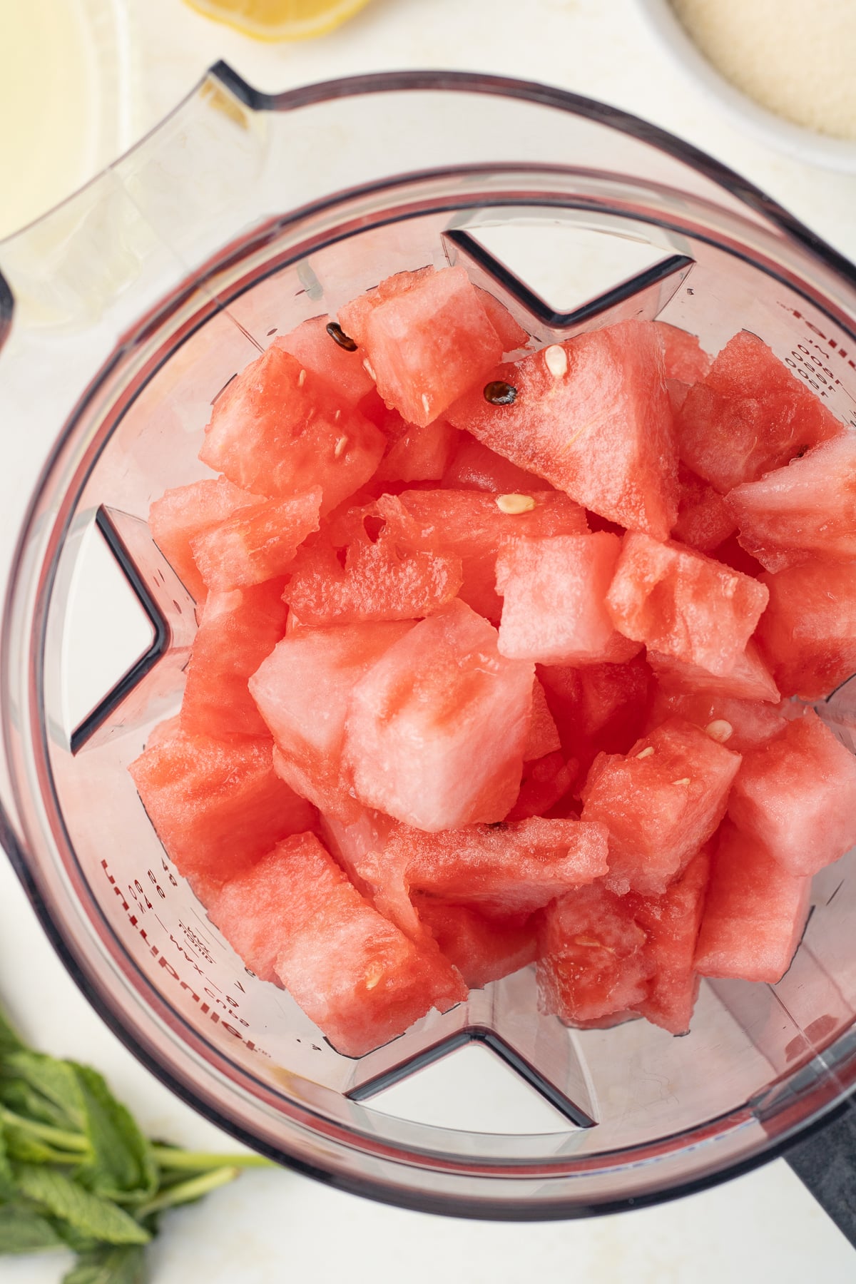 Overhead view of watermelon in a blender.