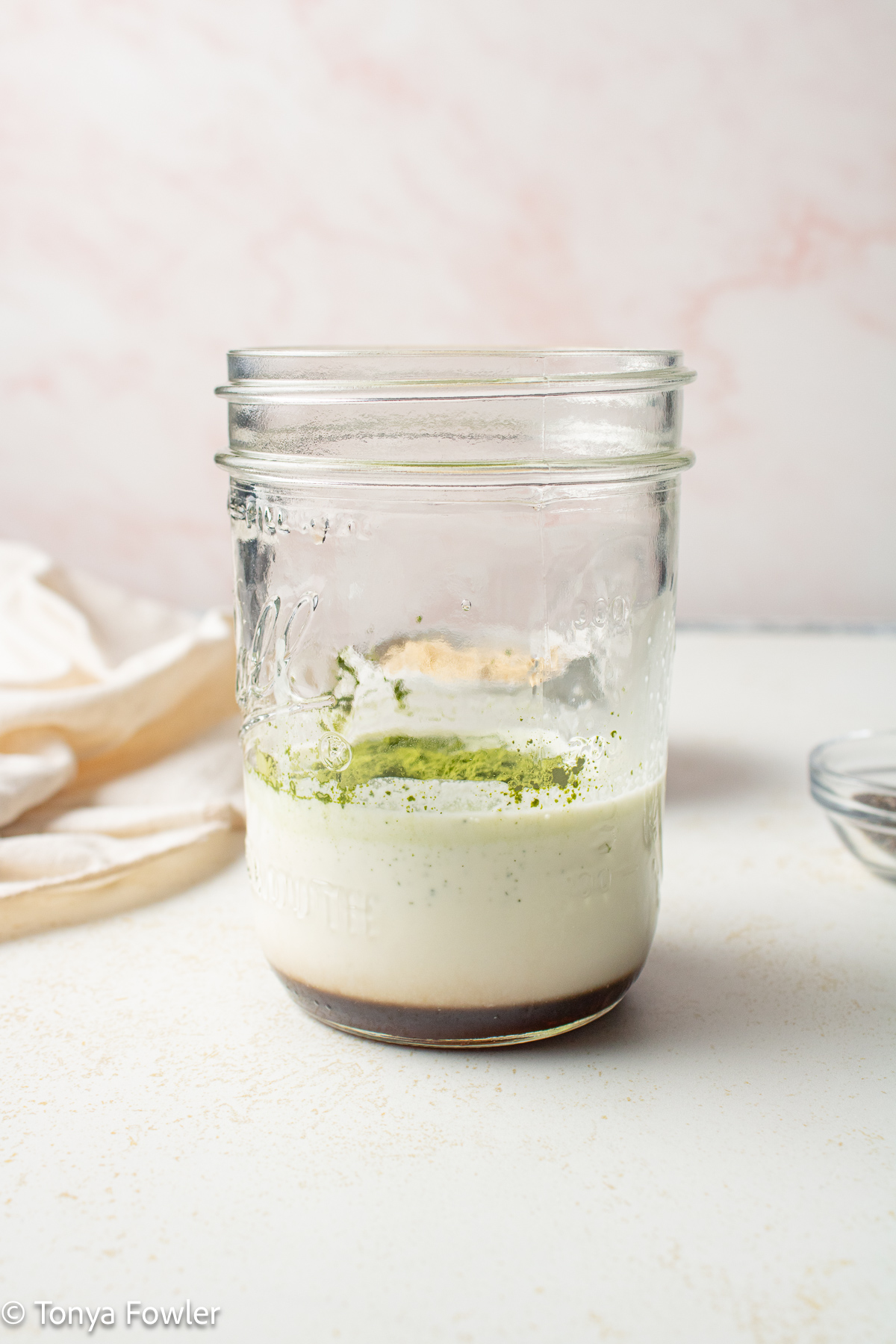 Milk and maple syrup in a jar. 
