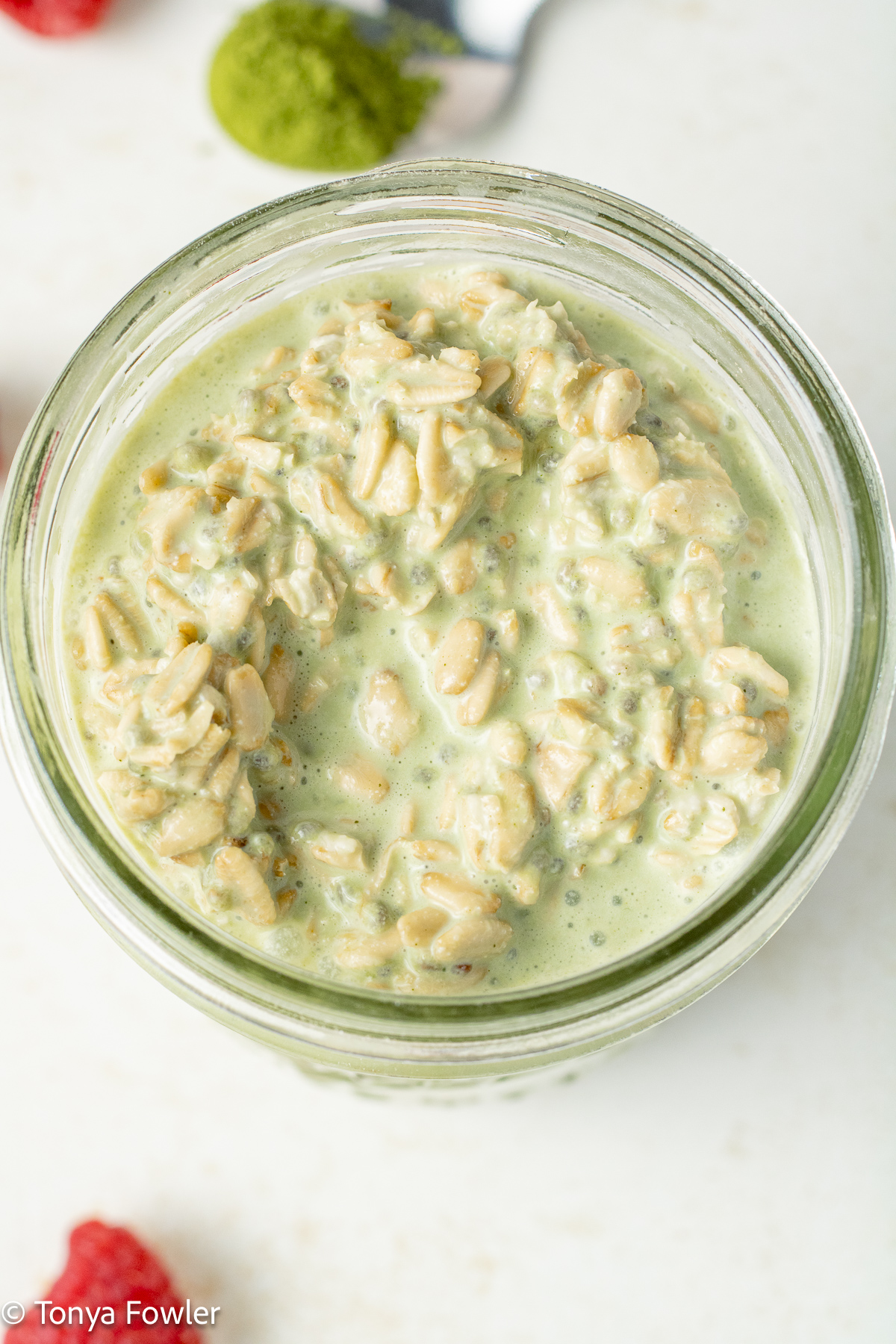 Close up image of overnight oats in a mason jar.