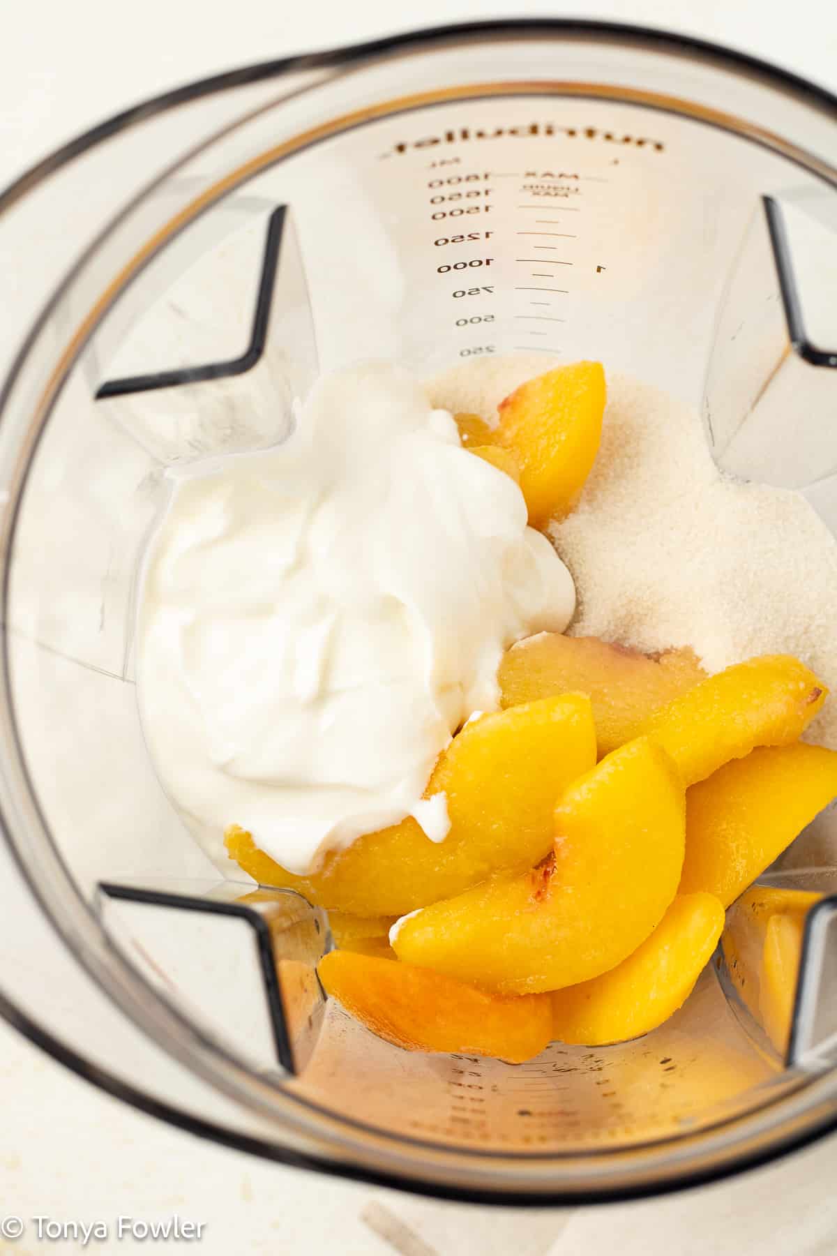 Peaches and yogurt in a blender.