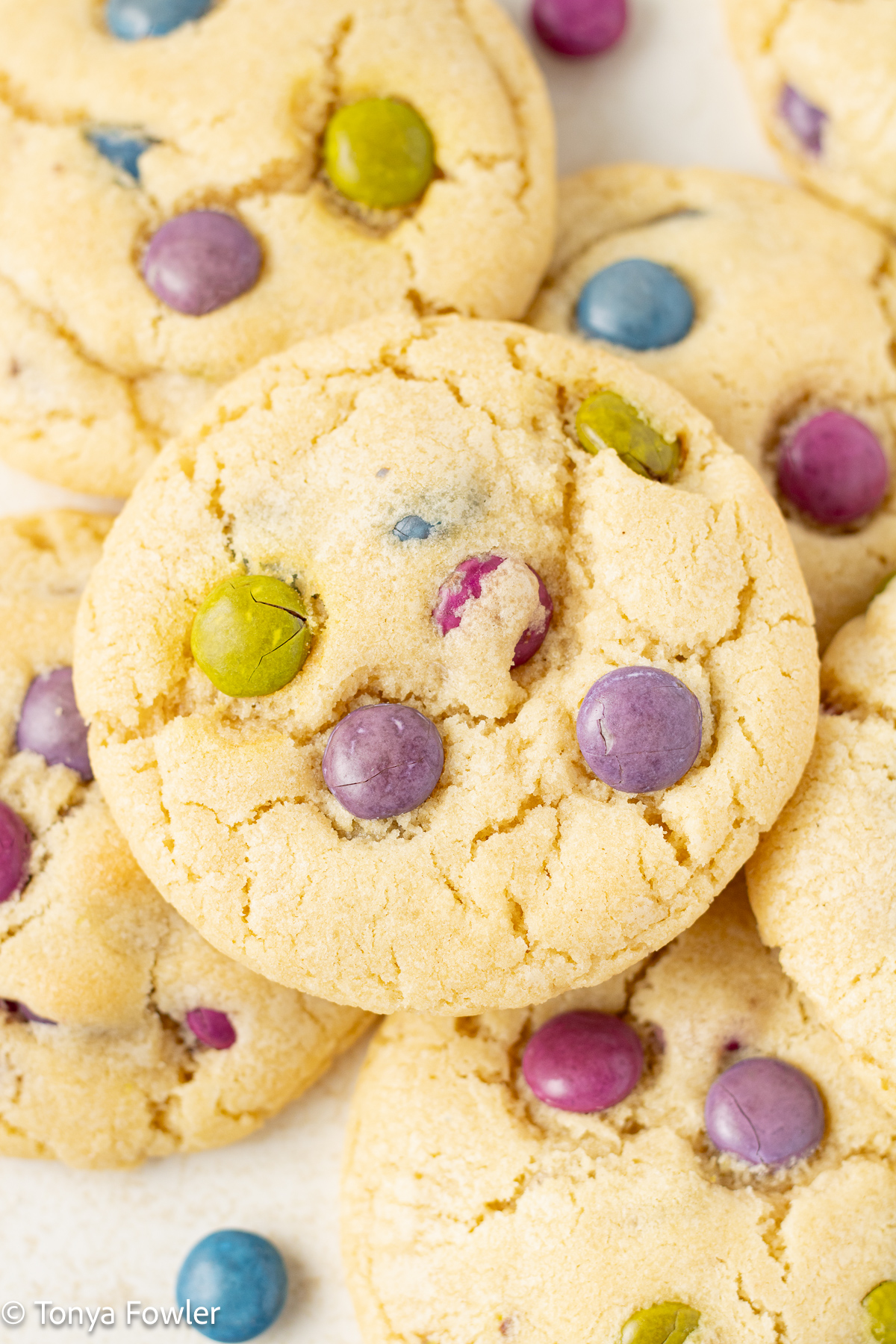 Close up image of a pile of cookies on a counter.