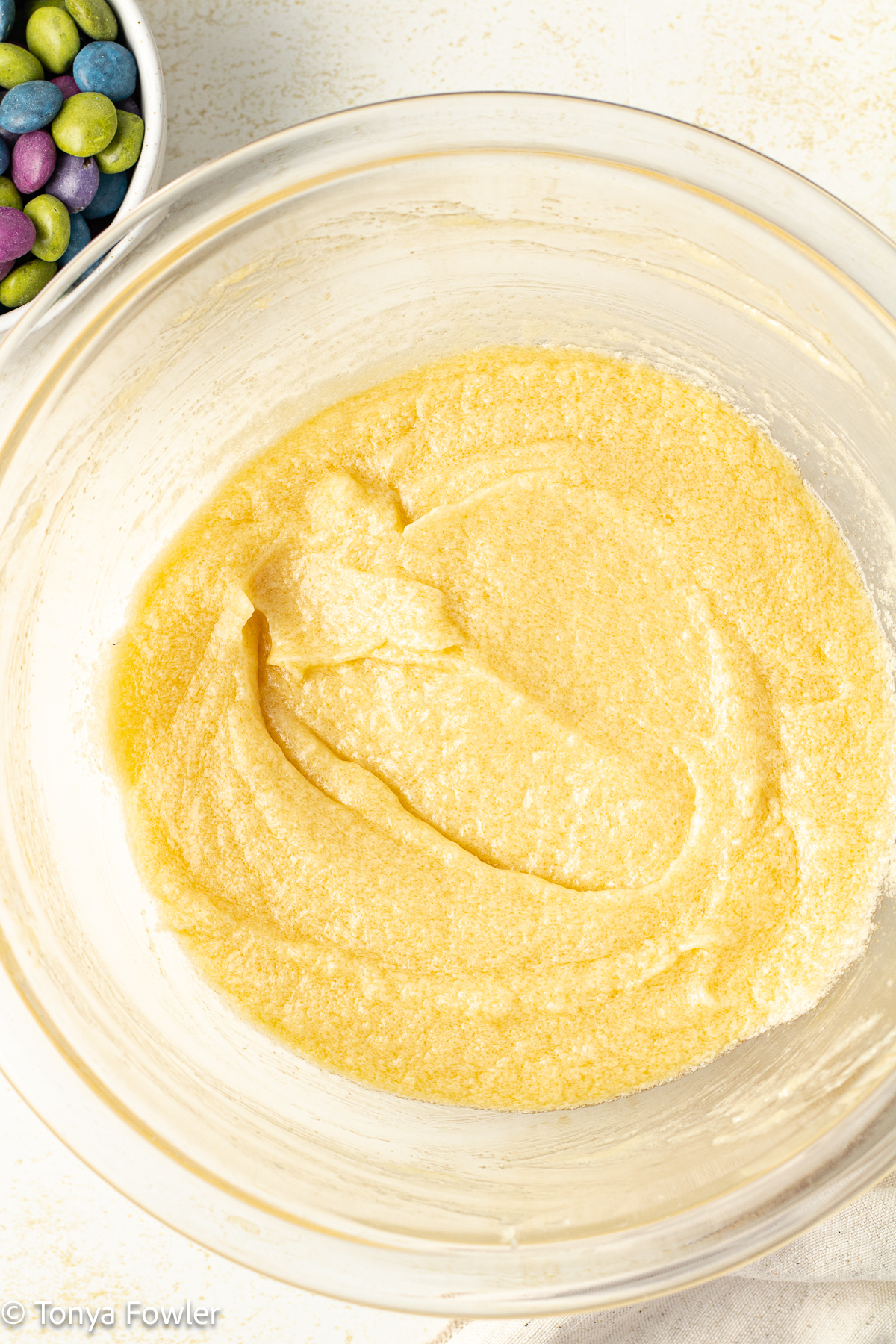 Creamed butter, sugar, and eggs in a bowl. 
