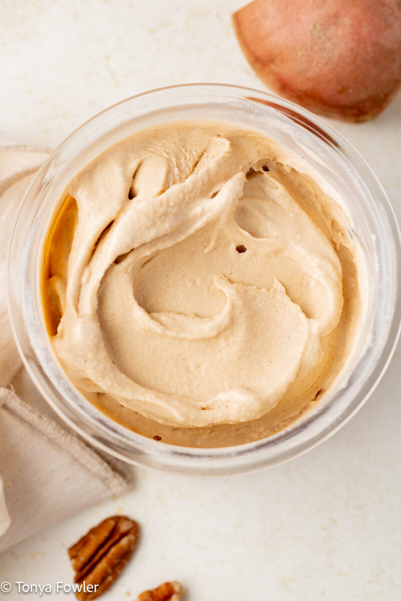 Overhead view of smoothed out ice cream in a container.