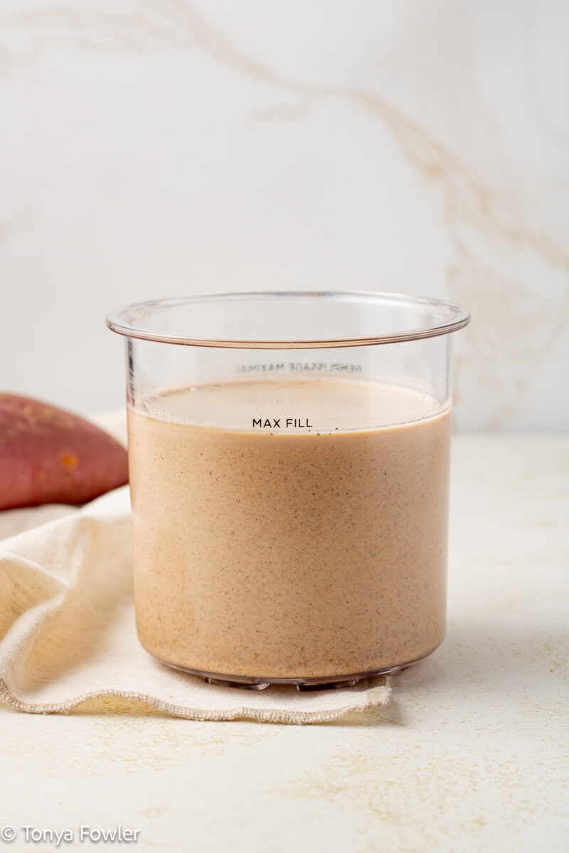 Straight on view of sweet potato ice cream base in a pint container.
