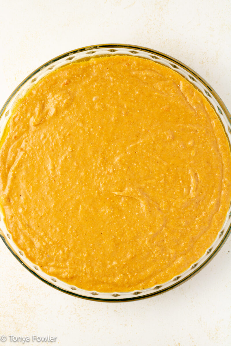 Cornbread batter in a pie pan.