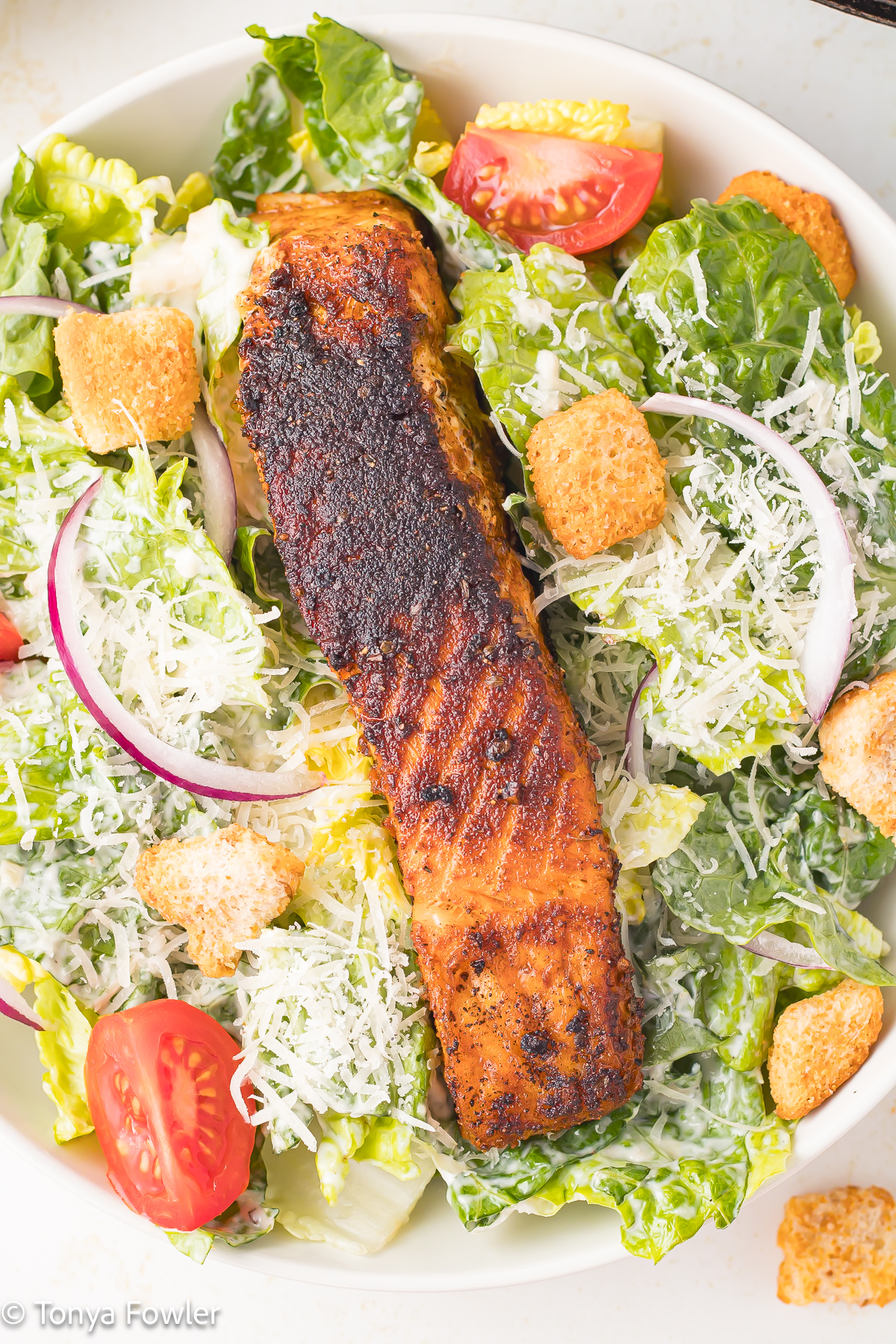 Close up image of salmon salad in a bowl.
