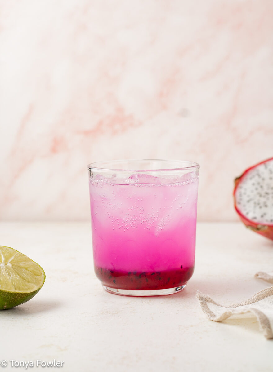 Glass filled with ice, sparkling water and syrup.