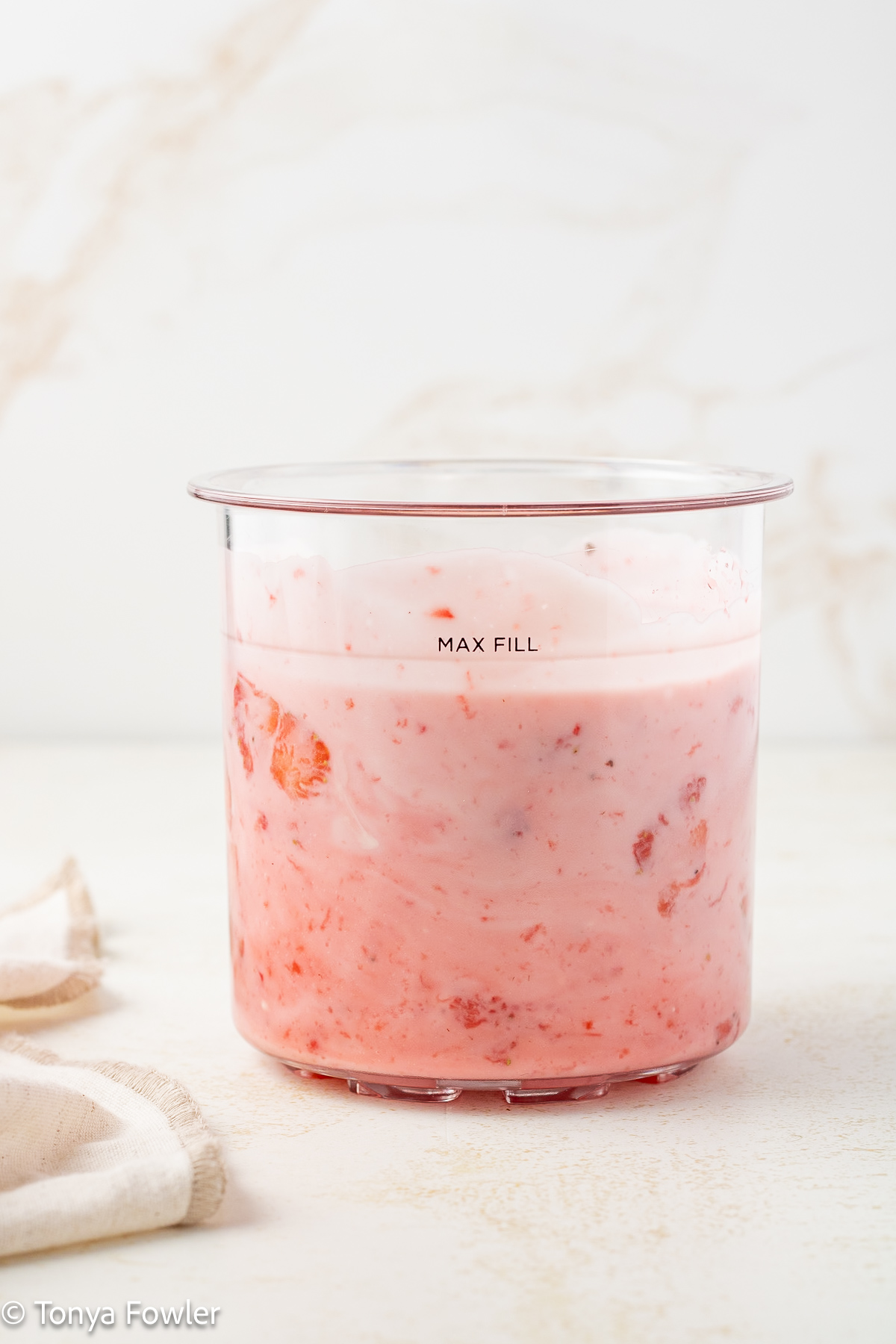Strawberry yogurt in a pint container.
