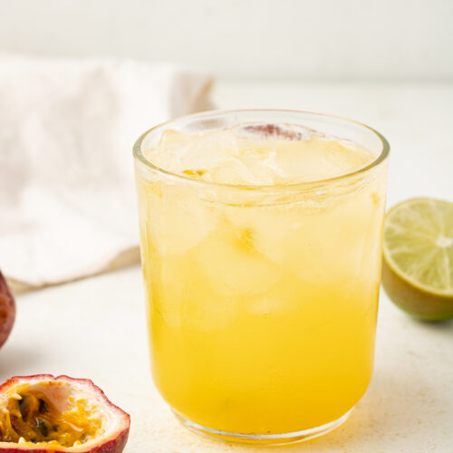 3/4 view of a passionfruit mocktail in a glass.