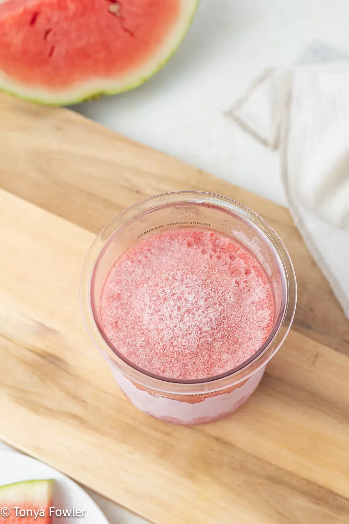 Overhead view of frozen sorbet in a pint container.