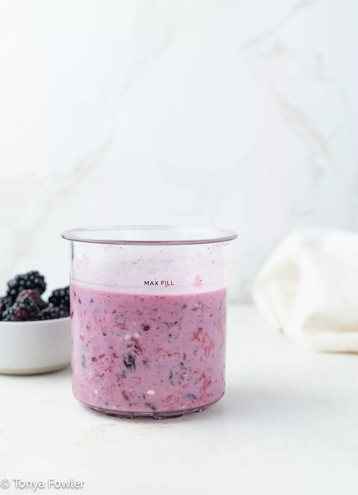Mixed berry yogurt in a pint container.