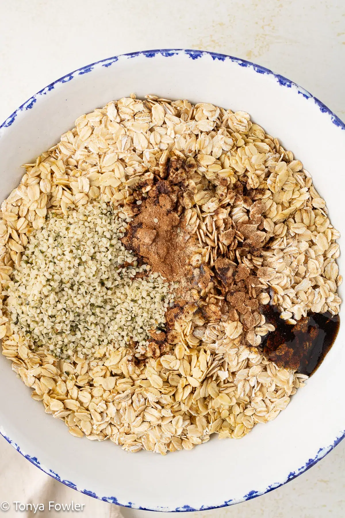 Rolled oats and spices in a bowl.