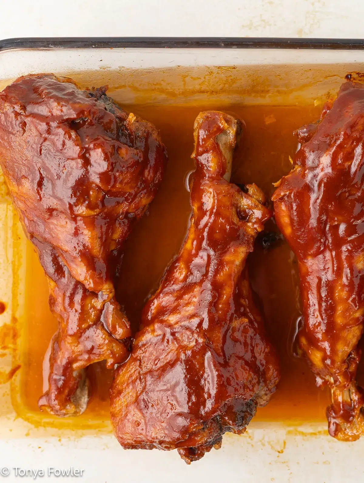 BBQ Turkey Legs in a baking dish.