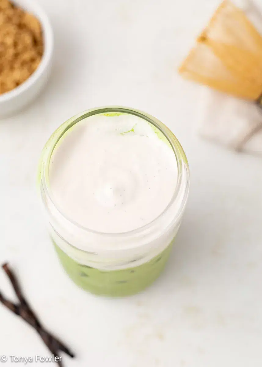 Overhead view of cold foam on a latte.