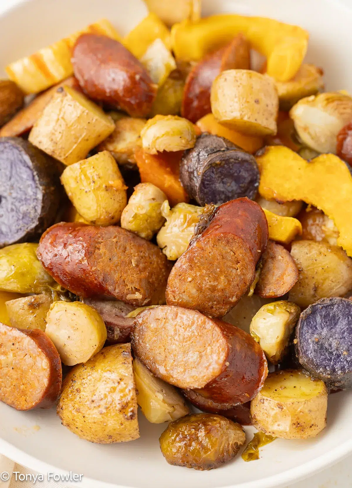 Turkey sausage and vegetables on a plate.