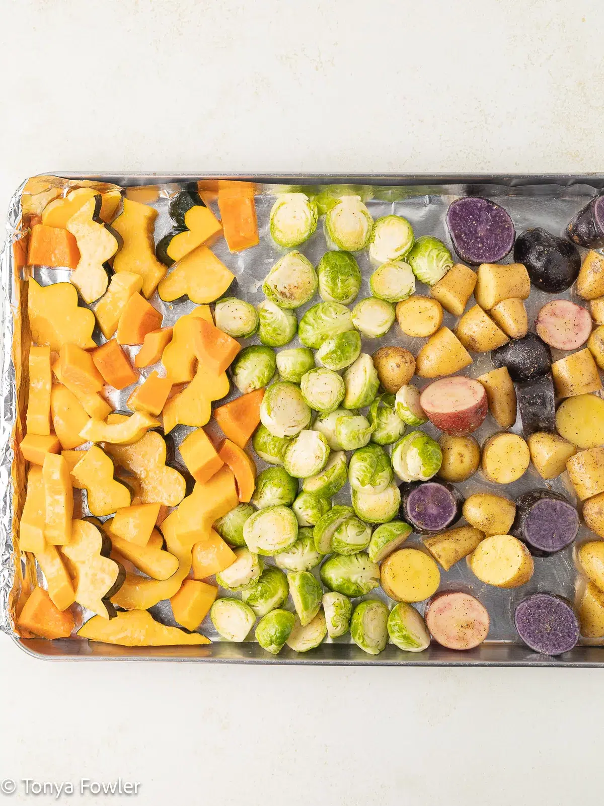 Chopped veggies on a sheet pan.