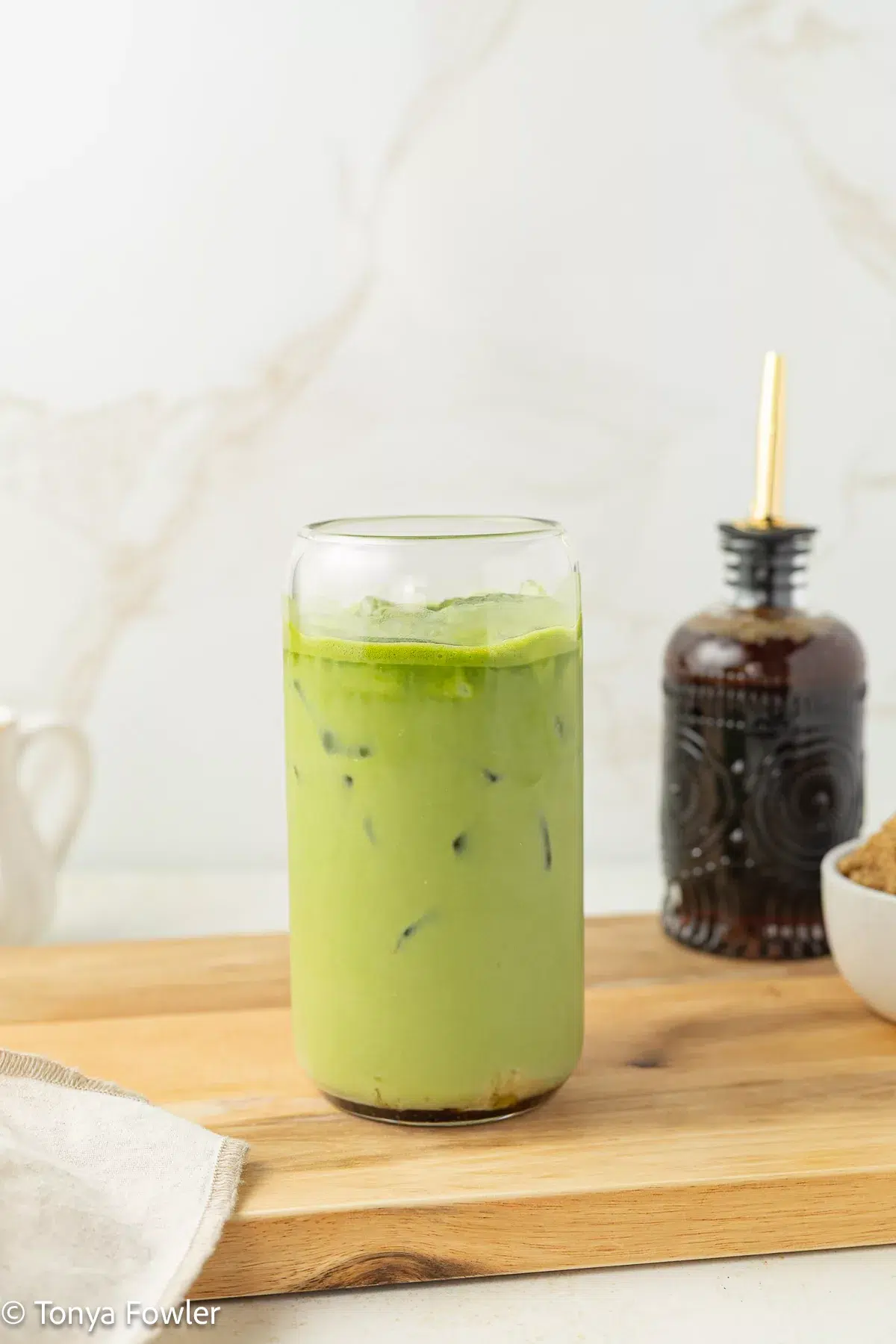 Brown butter matcha latte in a glass.