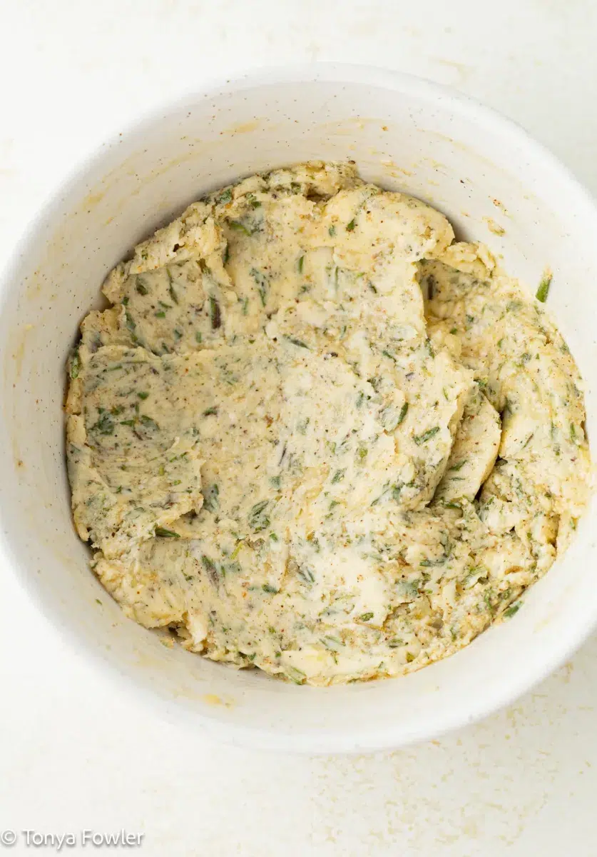 Herb compound butter in a bowl.