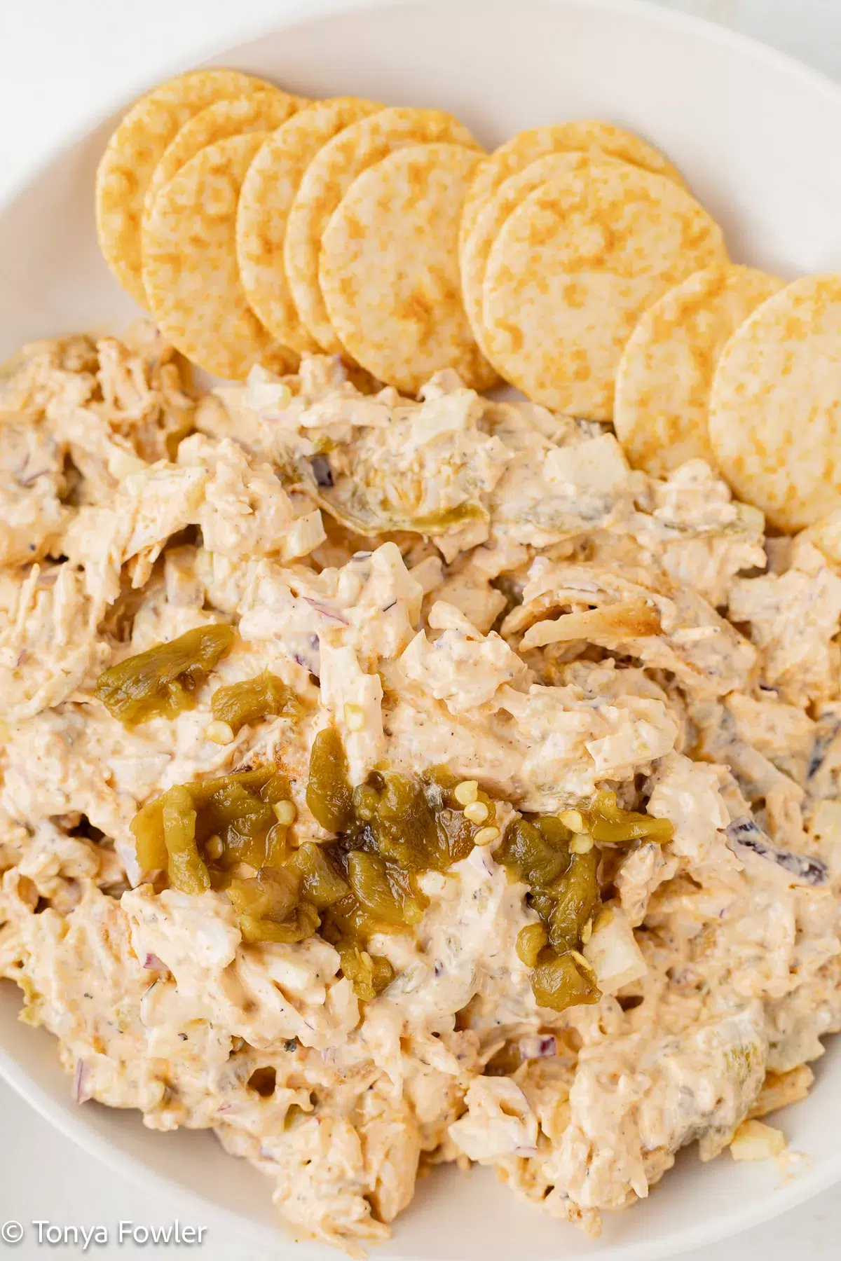 Hatch chile chicken salad in a bowl with crackers.