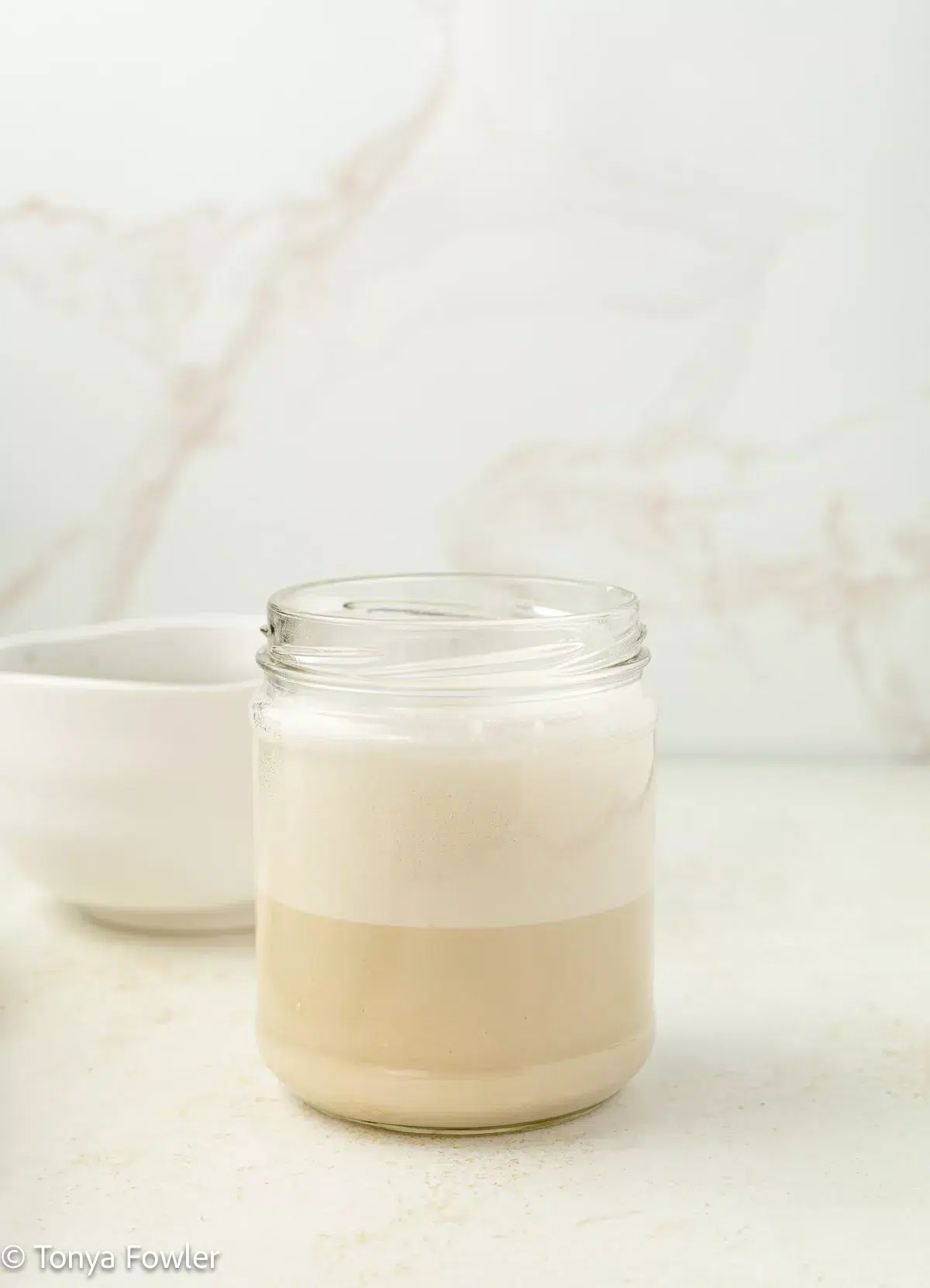 Protein powder mixed with water in a glass.