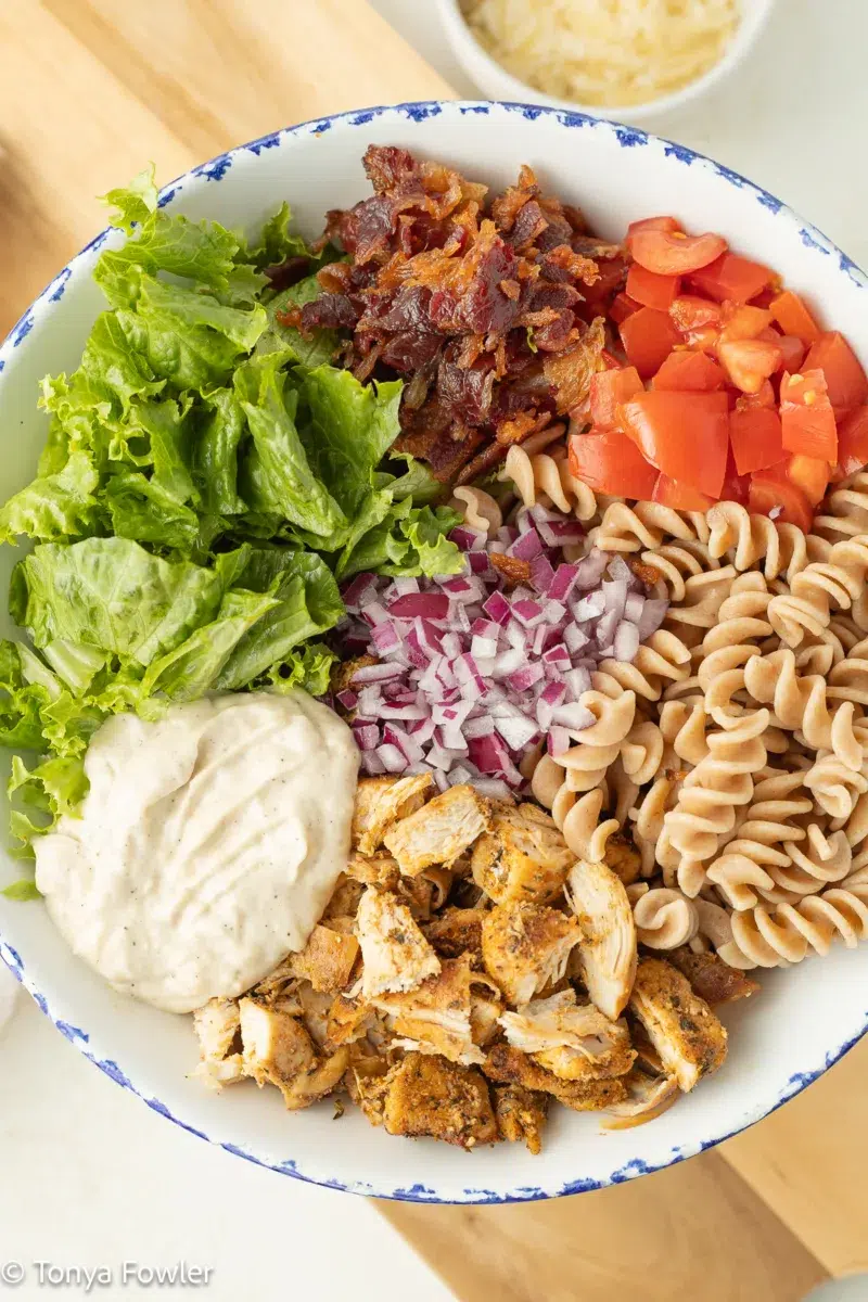 Pasta salad ingredients in a bowl.