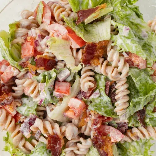 Close up image of beef bacon blt pasta salad in a bowl.
