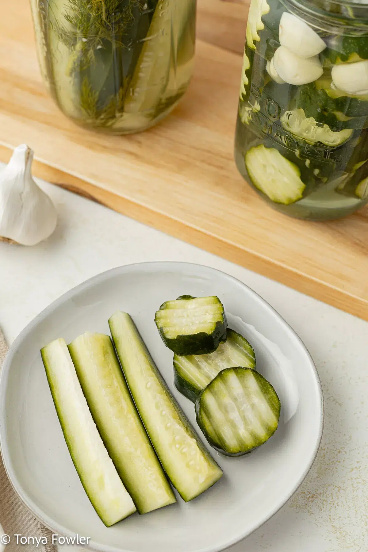 Homemade refrigerator pickles on a plate.
