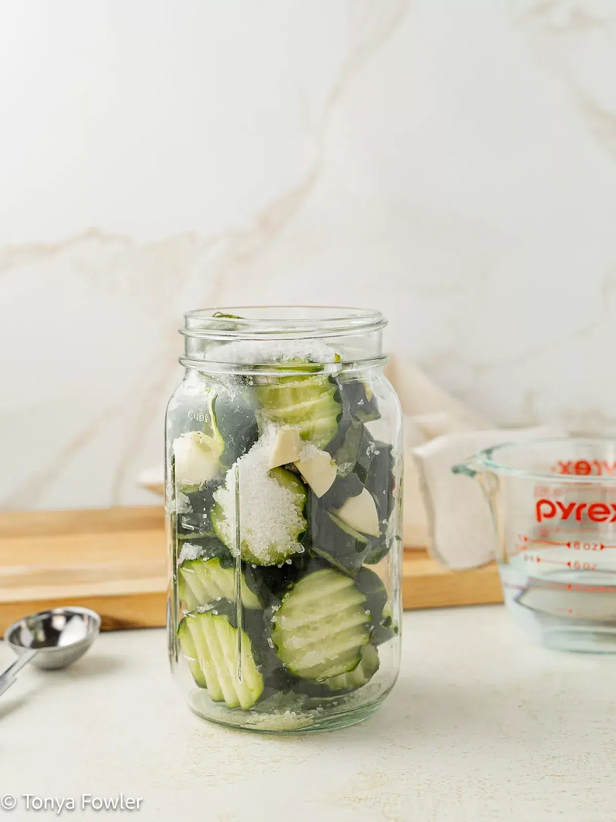 Cucumbers stuffed into a jar.