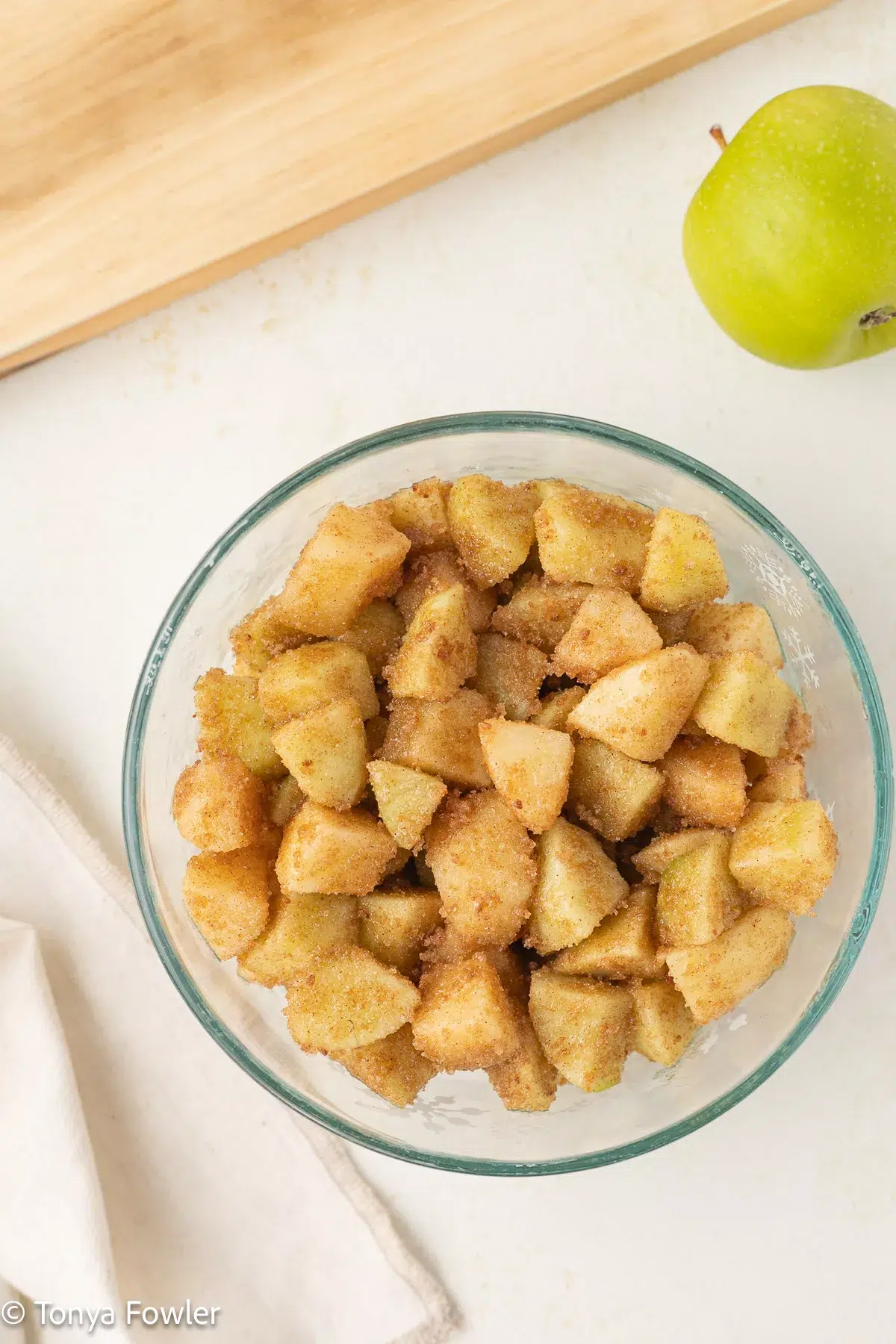 Apple covered in sugar in a bowl.