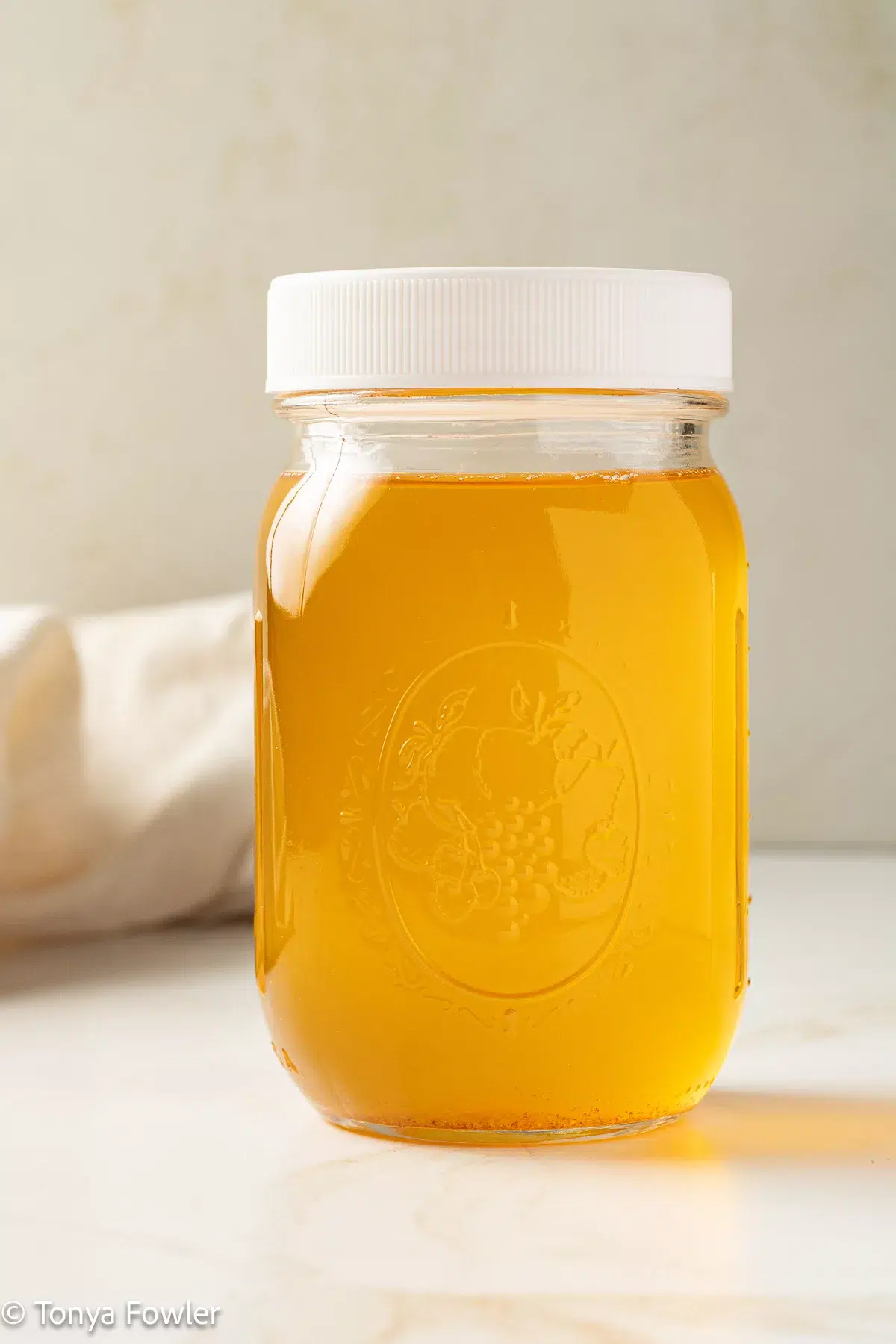 Ghee in a pint mason jar.