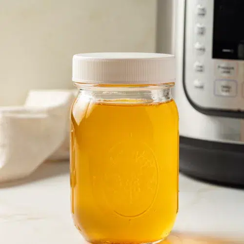 Ghee in a jar with an Instant Pot in the background.