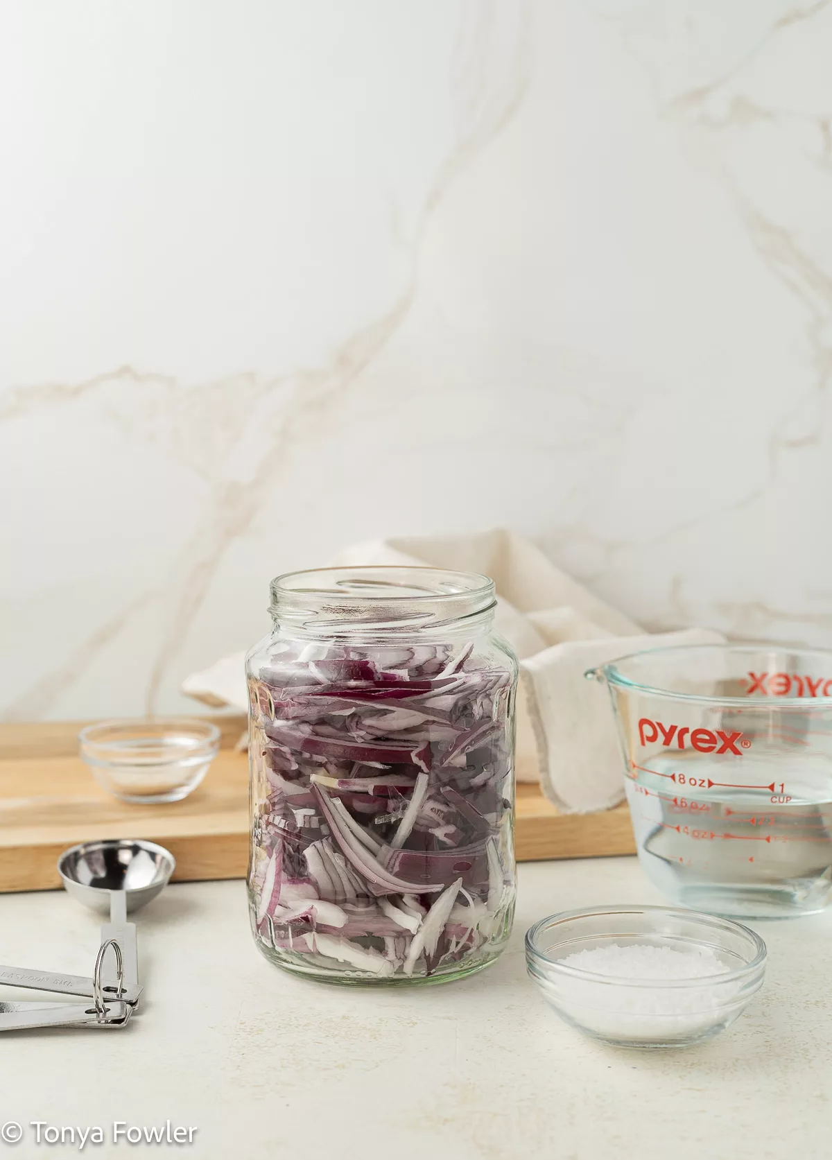 Sliced onions in a jar.