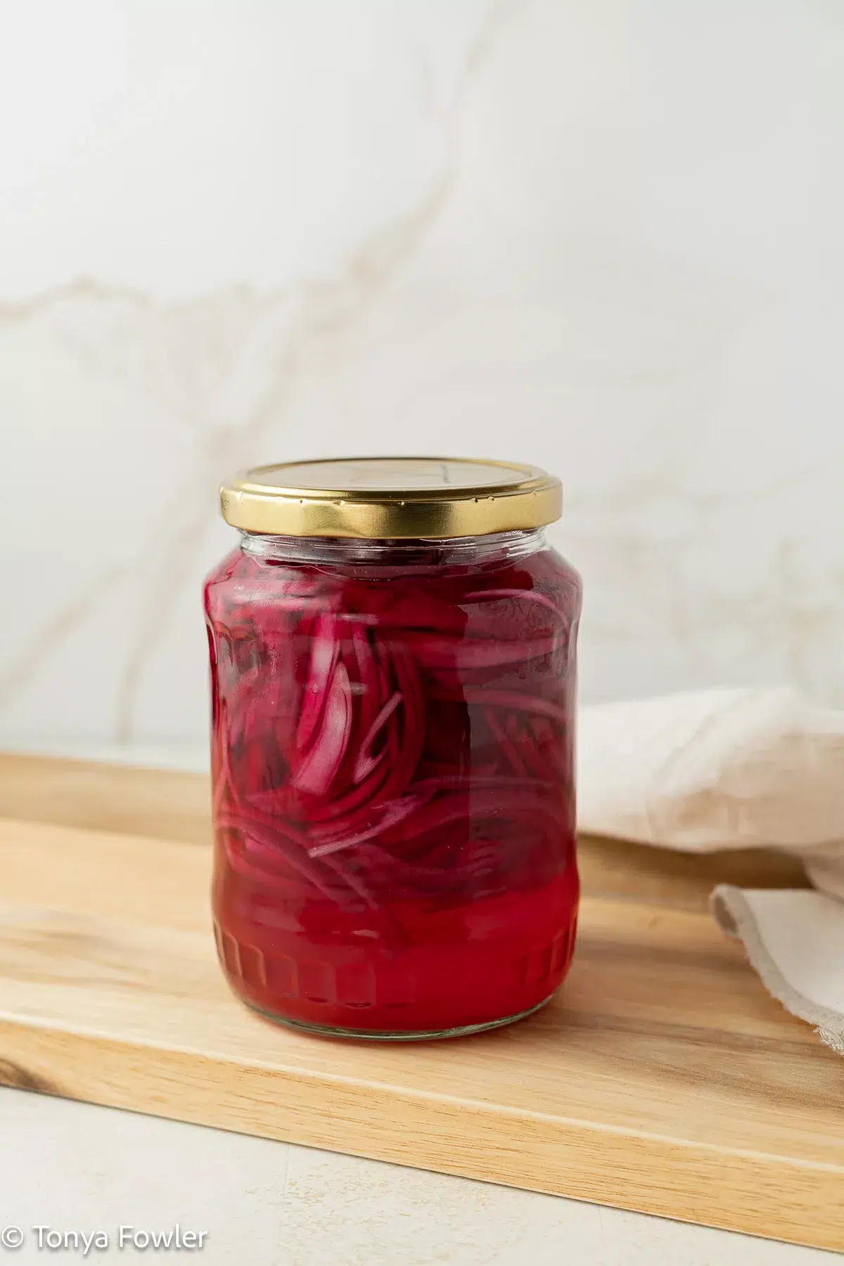 A jar of pickled onions.